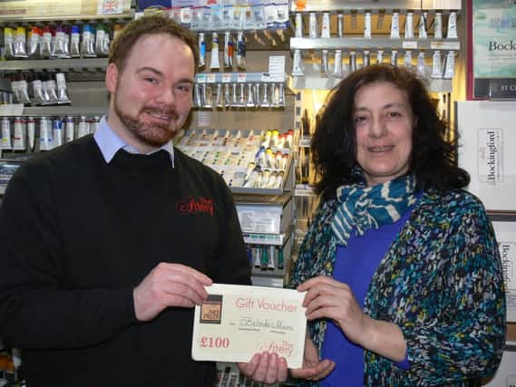 Barry Whitehouse, owner of the Artery art shop in Parsons Street, pictured with Belinda Moore, winner of the Ironstone People's Prize Award. NNL-160224-113732001