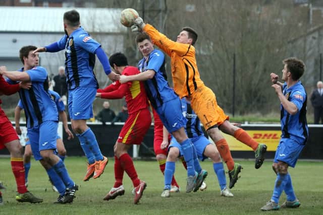 Winchester City keeper Brendan Norris deals with another Banbury United attack at Spencer Stadium