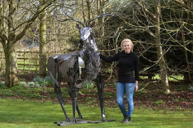 Blacksmith Julia Naysmith wth her stag sculpture.