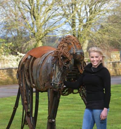 Blacksmith Julia Naysmith wth her horse sculpture.