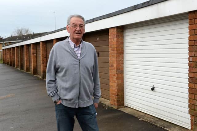 Ted Jenkins pictured outside his white garage on Evenlode