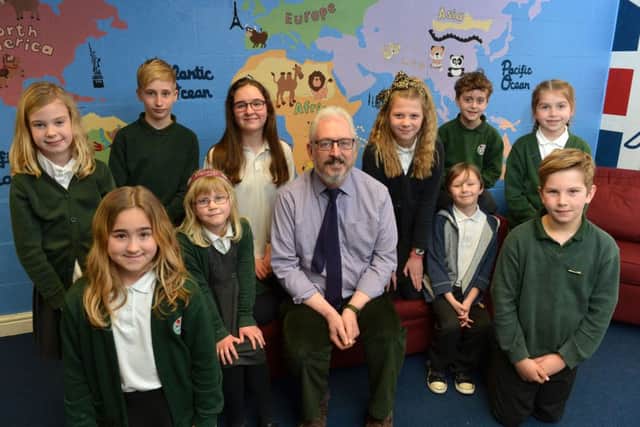 Philip Percival, the head of Middleton Cheney Primary Academy is retiring. Pictured with the school council. NNL-160803-154459009