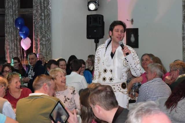 Ian Street, senior manager at Hamptons Cirencester office, performs as Elvis Presley at a Hamptons International charity quiz evening at The Church House in Banbury