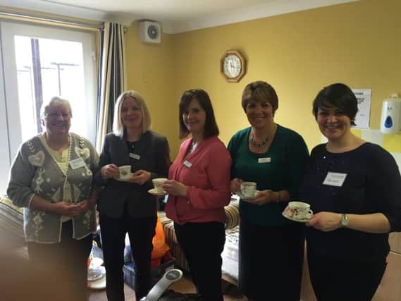 Katharine House Hospice's chief executive Angharad Orchard, pictured second from left, at the Care for a Cuppa event organised by Edd Frost and Daughters last Tuesday. NNL-161103-115753001