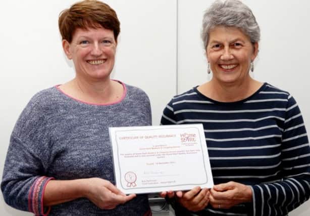 Senior Organiser Jane Skelton and trustee Anne Waters with the Quality Assurance certificate. NNL-161003-121401001