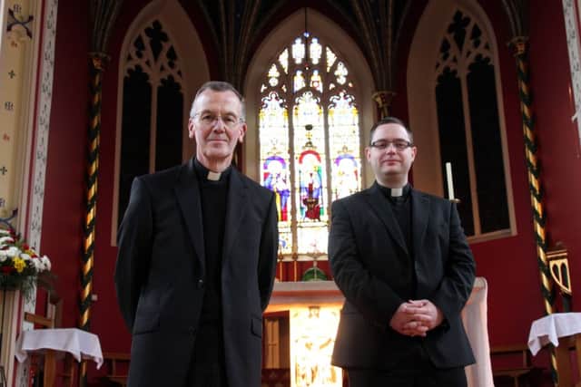 St John's Roman Catholic Church has started raising funds to replace three stained glass windows. Pictured, Father Richard Walker and Father Craig Szmidt NNL-160314-092817009