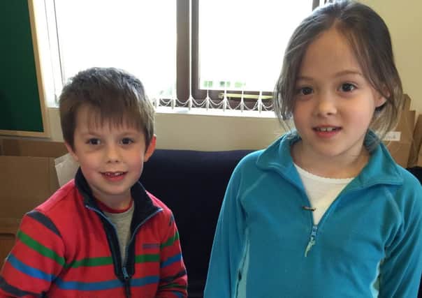 Archie Emerson, aged 6, and Natalie Page, aged 8, with Tommy the tortoise at Tyseo Methodist Church's Messy Church event PNL-160314-155659001
