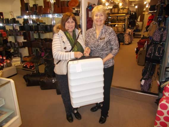 Shona Bell, left, pictured at Cellini receiving her bag after winning a competition in the Banbury Guardian. NNL-160321-130424001