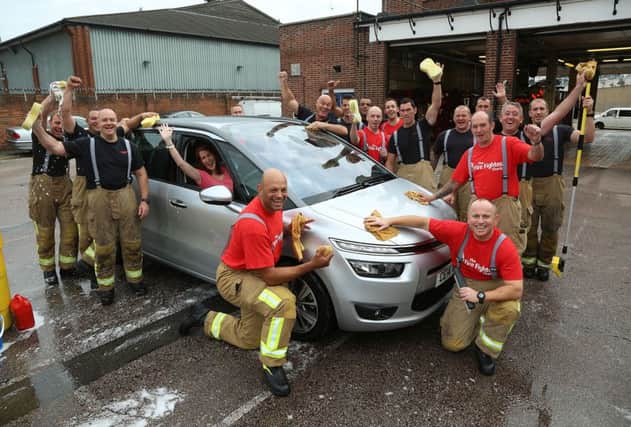 Brackley firefighters will be washing cars on Saturday to raise funds for The Fire Fighters Charity. Picture by Stewart Turkington. NNL-160317-170752001