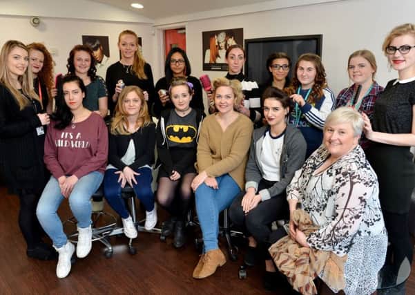 Avant-garde hairdressing session at Banbury and Bicester College. Samantha Smith, hardressing tutor, seated right, with hairdressing students who were stylists and models. NNL-160419-144249009