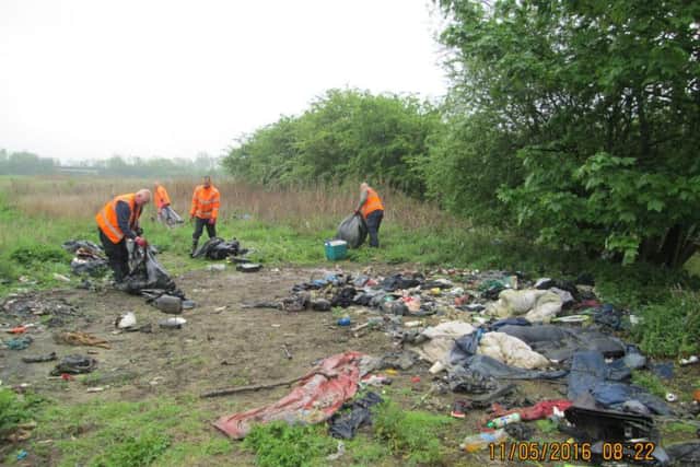 Workers clear away the huge flytip