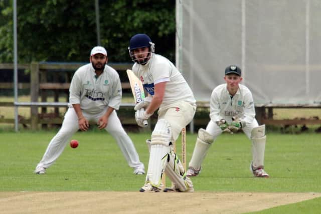 Cropredy batsman Joe Fox faces a delivery as Abington Vale wicket keeper Adam Scholey and slip Amith Premkumar get set