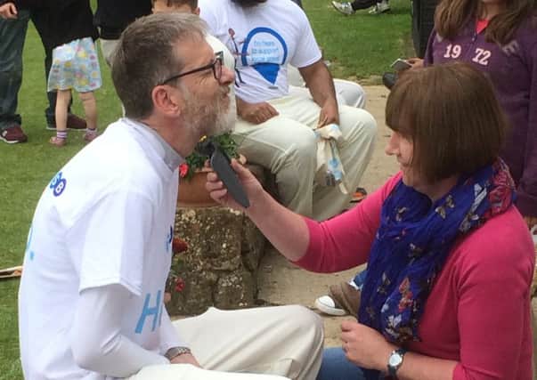 TSB Banbury branch manager Gareth Nichols had his beard shaved off at a cricket match organised to raise money for Katharine House Hospice. NNL-160706-151305001