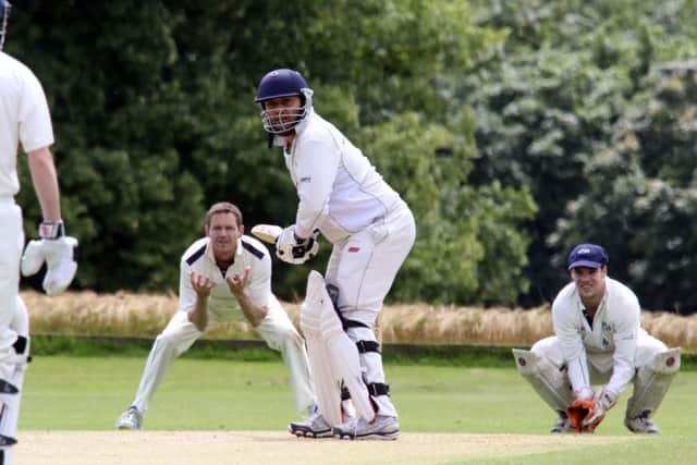 AbingdonVale batsman Amith Premkumar faces a delivery as Sandford wicket keeper Danny Smith and Mark Robey look on