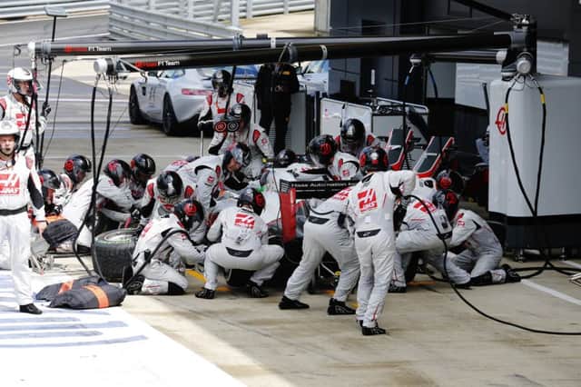 The Haas F1 pit-stop crew swing into action at Silverstone