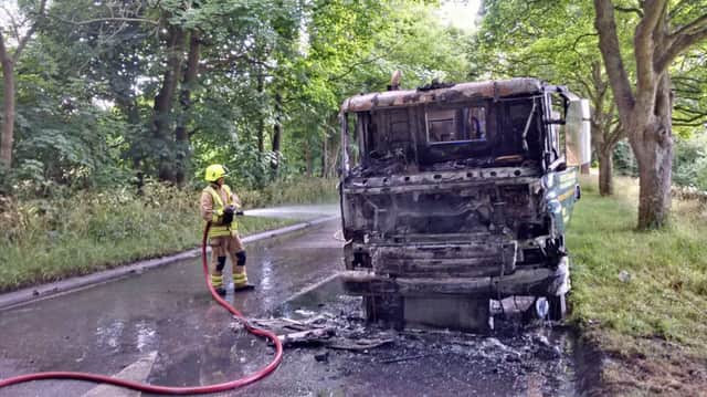 Firefighters tackling the lorry fire