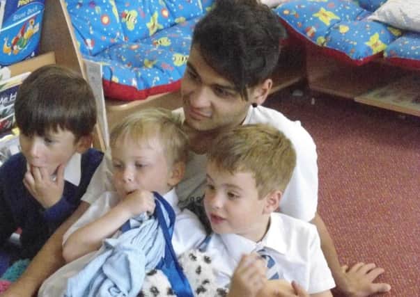 Autistic teenager Reza Irvani helping out at Wroxton Primary School