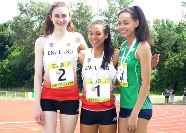 Emily Thompson, Khahisa Mhlanga and  Davicia Patterson after the 800m