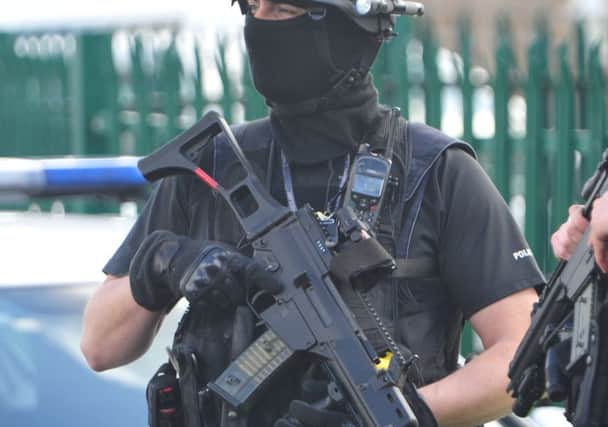 An armed police officer