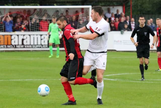 Brackley Town's Steve Diggin gets past FC United of Manchester's Luke Ashworth at St James Park. And Diggin opened his account at Gainsborough on Monday.