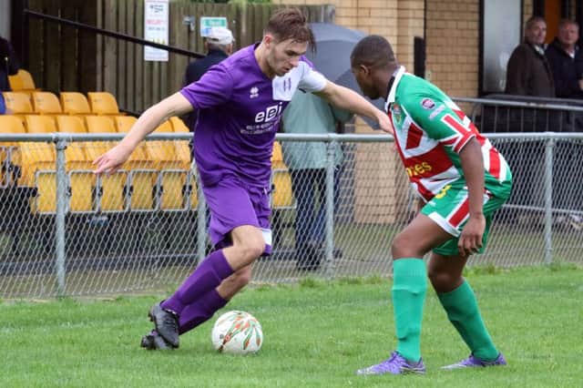 Daventry Town's Jordan Orosz takes on Windsor's George Ademiluyi during Saturday's FA Vase victory
