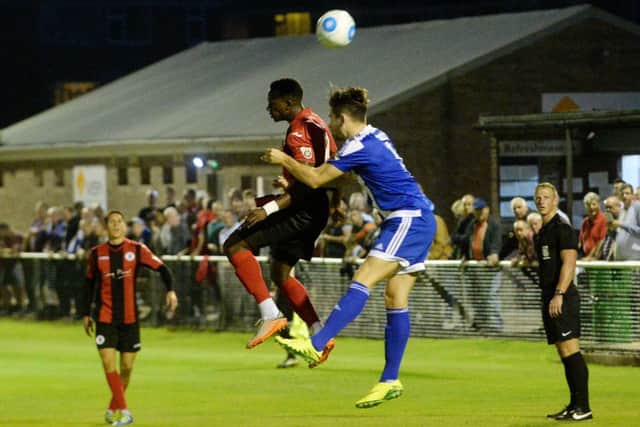 Brackley Town's David Moyo wins a header against Worcester City on Tuesday