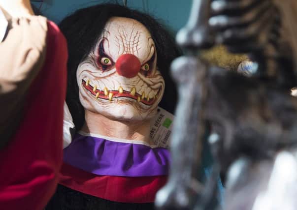 Dozens of incidents involving "killer clowns" have been reported across Britain, with police warning that people caught clowning around will face arrest. (Photo credit: Saul Loeb/AFP/Getty)