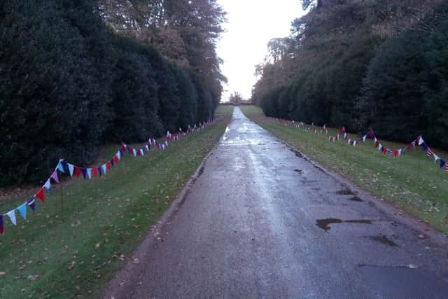 Bunting lines the driveway of Upton House NNL-161111-132501001