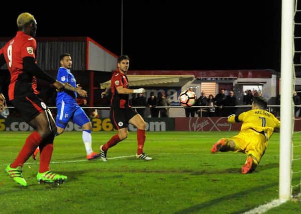 James Armson fires home his second goal past Gillingham keeper Stuart Nelson (picture: Jake McNulty)