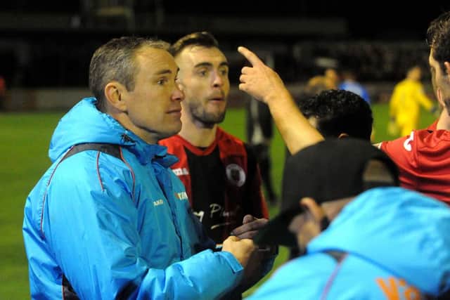 Brackley Town boss Kevin Wilkin encourages his troops for extra-time in Wednesday's Emirates FA Cup replay