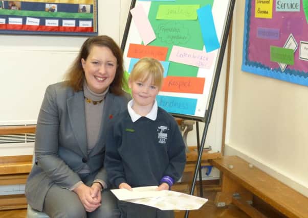 The winning and runner-up entries for MP Victoria Prentis' Christmas card competition. Mrs Prentis with the winner, six-year-old Lucy England. NNL-161124-163549001