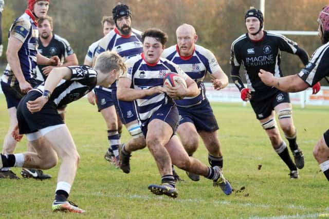 George Ding, who made his debut for Banbury Bulls, takes on the Royal Wootton Bassett defence at Bodicote Park