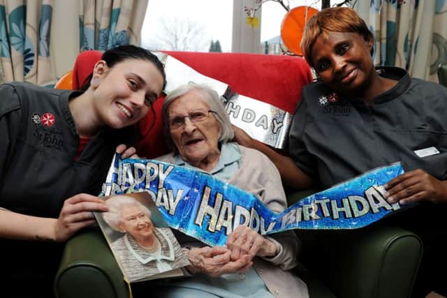Joyce Williamson, at Larkrise Care Home, Banbury, is 100 years old. Carers, left, Charlotte Hare and right, Janet Cross. NNL-161122-132335009