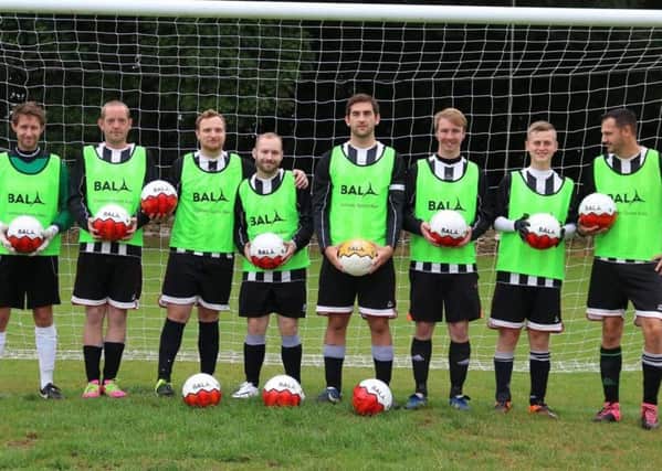 The Chipping Norton squad with their new kit and footballs