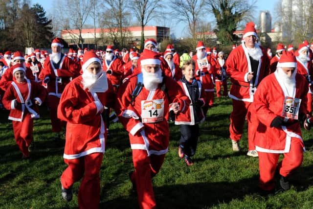 Banbury Santa Fun Run for Katharine House Hospice at Spiceball Park. Santas are off in the fun run. NNL-160412-131131009