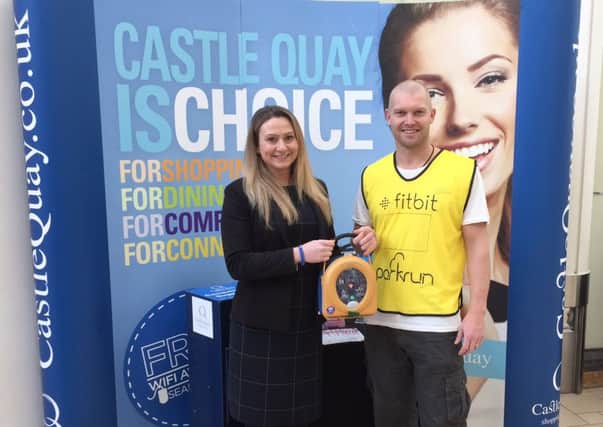 Rebecca Deeley, office manager at Castle Quay and Michael Dobson, event director at Banbury Parkrun NNL-161212-112617001