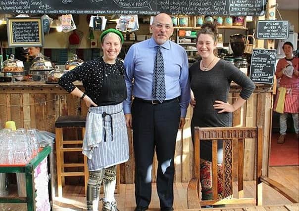 MP for Stratford-on-Avon Nadhim Zahawi visited four rural enterprises in Whichford. Picture by Frances Boyle. With Maia and Christine at the Straw Kitchen caf?. NNL-161214-165929001