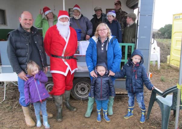 Albert Davies, three with Santa, his siblings Lewis and Amelia and grandparents Steve and Tracey