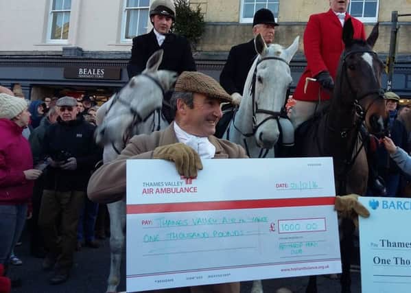 Heythrop Hunt Club presents a cheque to Thames Valley Air Ambulance during its Boxing Day meet