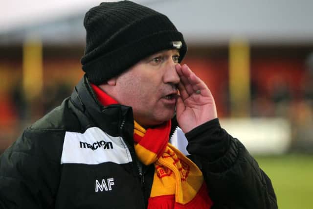 Banbury United manager Mike Ford urges on his side against Leamington