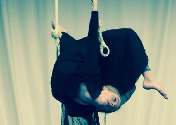 Year 9 pupil Althea in rehearsal on the trapeze