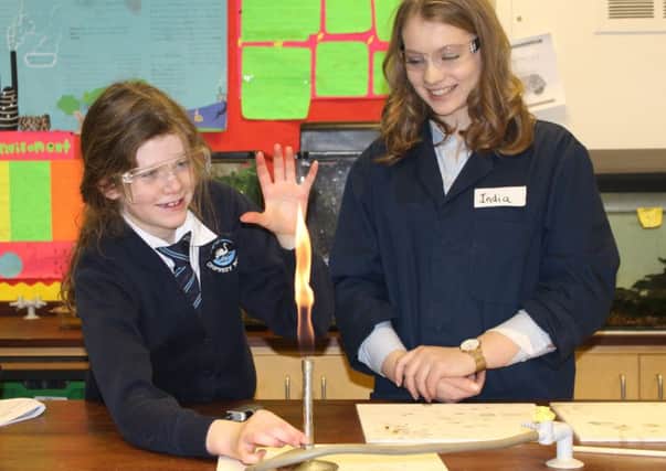 Mollie Irvine, from Cropredy School, with a Bloxham School student during a forensic workshop. NNL-170130-103533001