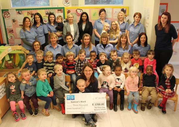 Close Nursery, Banbury with a cheque for the Oxford Children's Hospital NNL-170125-123609001