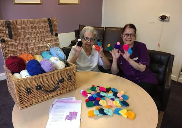 Resident Doreen Stone and care assistant Karen Boniface with the tiny hats