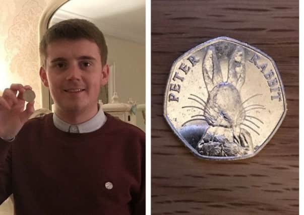 CaolÃ¡n McGinley, pictured with the coin he found. DJL-170131-120057024