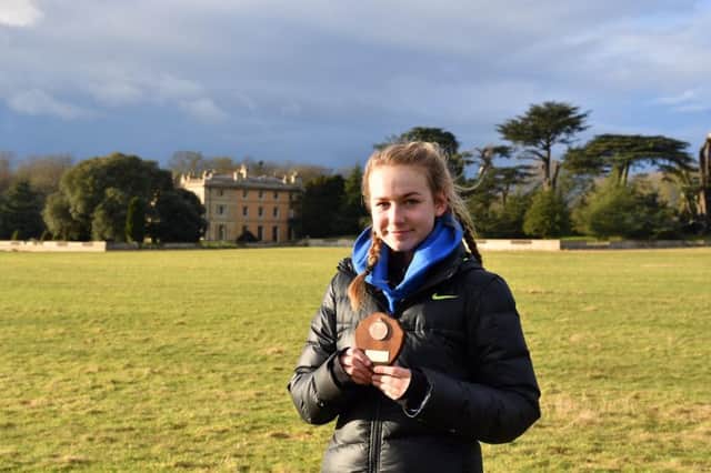Banbury Harrier Alex Scrivener with her bronze medal she gained in the Midlands Cross Country Championships at Prestwold
