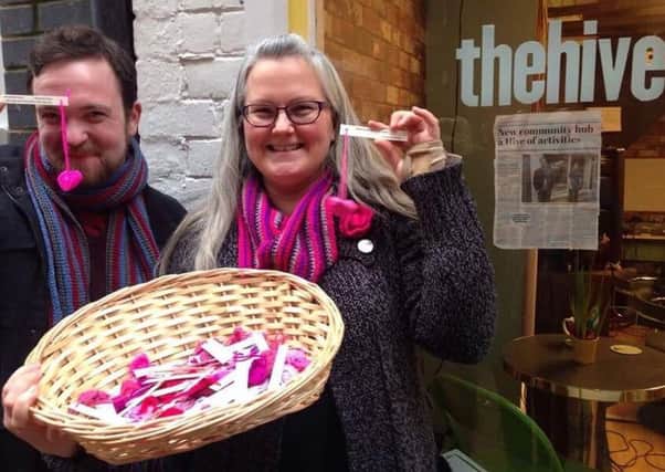 Luke Cheetham, of The Hive and artist Lucy Tustian, who was giving out knitted hearts for Valentine's Day. NNL-170215-123710001