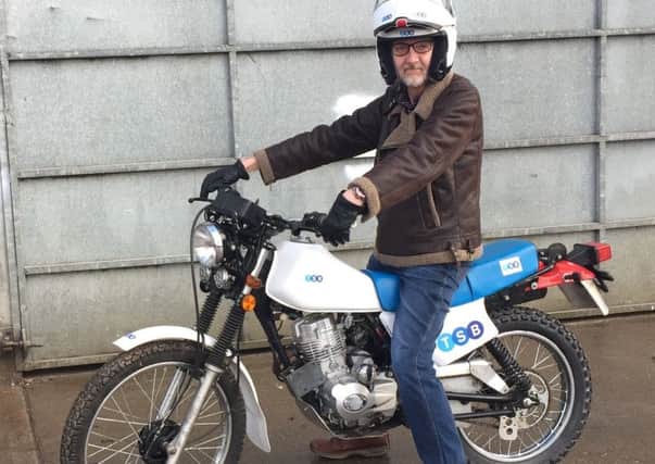 Gareth Nichols on his branded motorcycle
