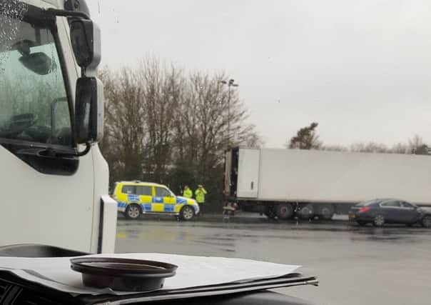 Thames Valley Police removing 11 refugees from the back of a lorry at junction nine/10 of the M40. NNL-170215-162030001