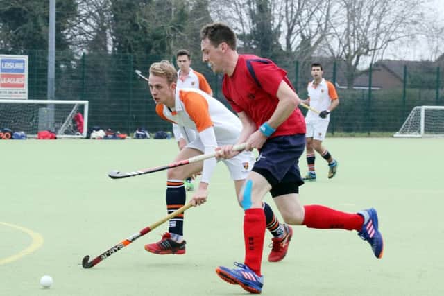 Banbury's Steve O'Connor goes past Old Cranleighans' George Pettit